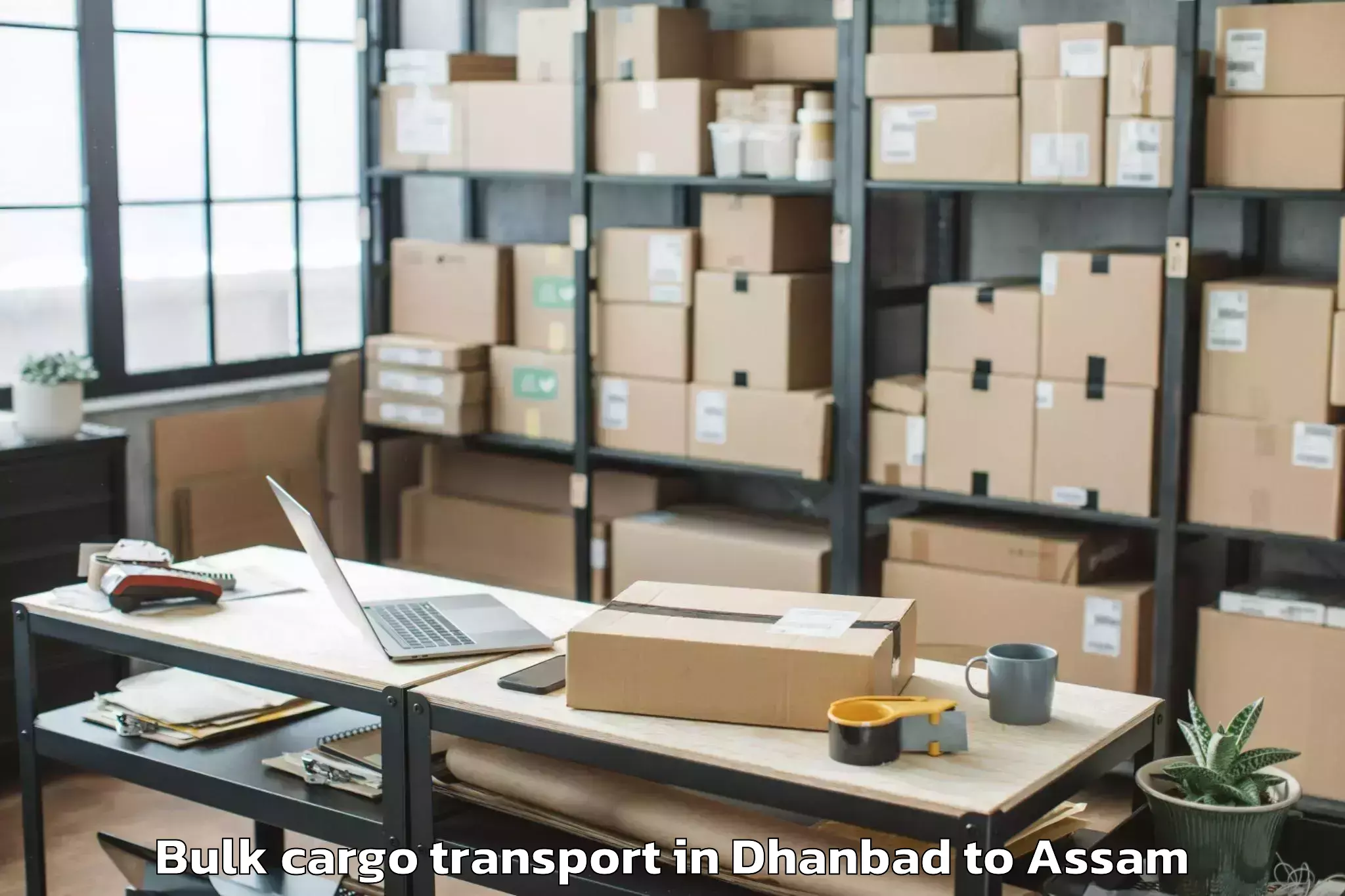 Book Your Dhanbad to Numaligarh Bulk Cargo Transport Today